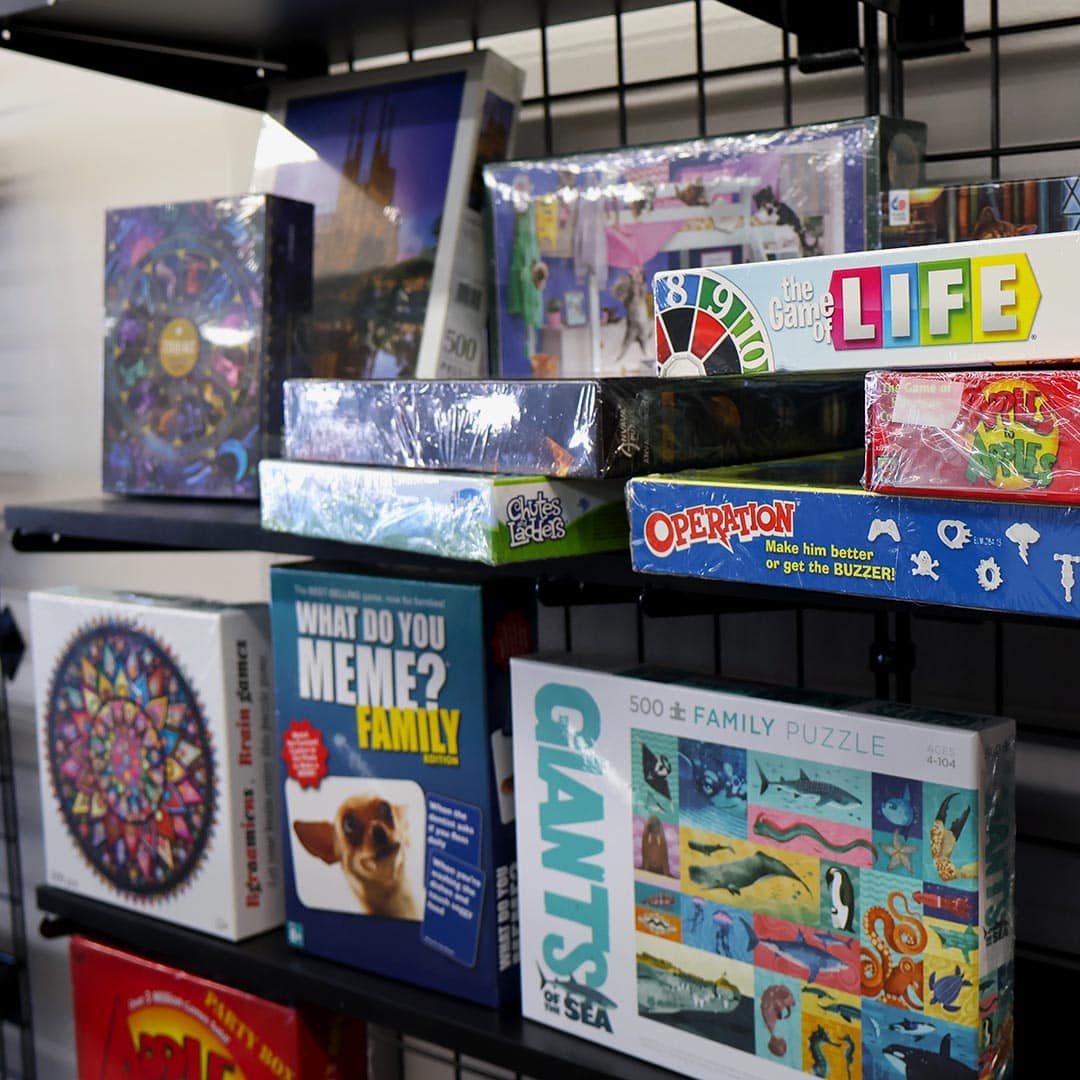 Assorted board games on display shelf