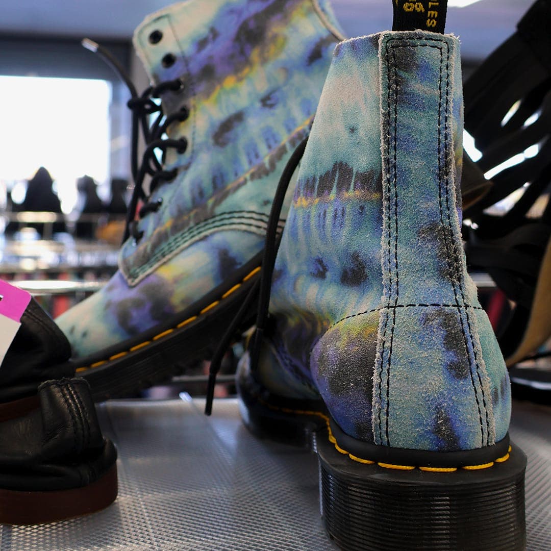 Colorful, patterned ankle boots on display.